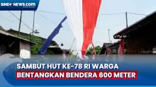 Sambut HUT ke-78 RI Warga Bentangkan Bendera 600 Meter di Atas Jalan Desa