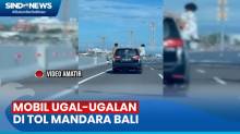 Viral! Mobil Ugal-Ugalan di Tol Bali, 2 Penumpang Duduk di Jendela