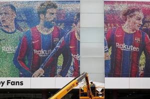Poster Lionel Messi di Camp Nou Mulai Dilucuti