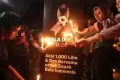 Gagal Jadi Tuan Rumah Piala Dunia U-20, Suporter Nyalakan 1.000 Lilin Simbol Harapan Indonesia Bangkit