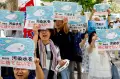 Bawa Poster Godzilla, Demonstran Protes Pembuangan Air Reaktor Nuklir Fukushima